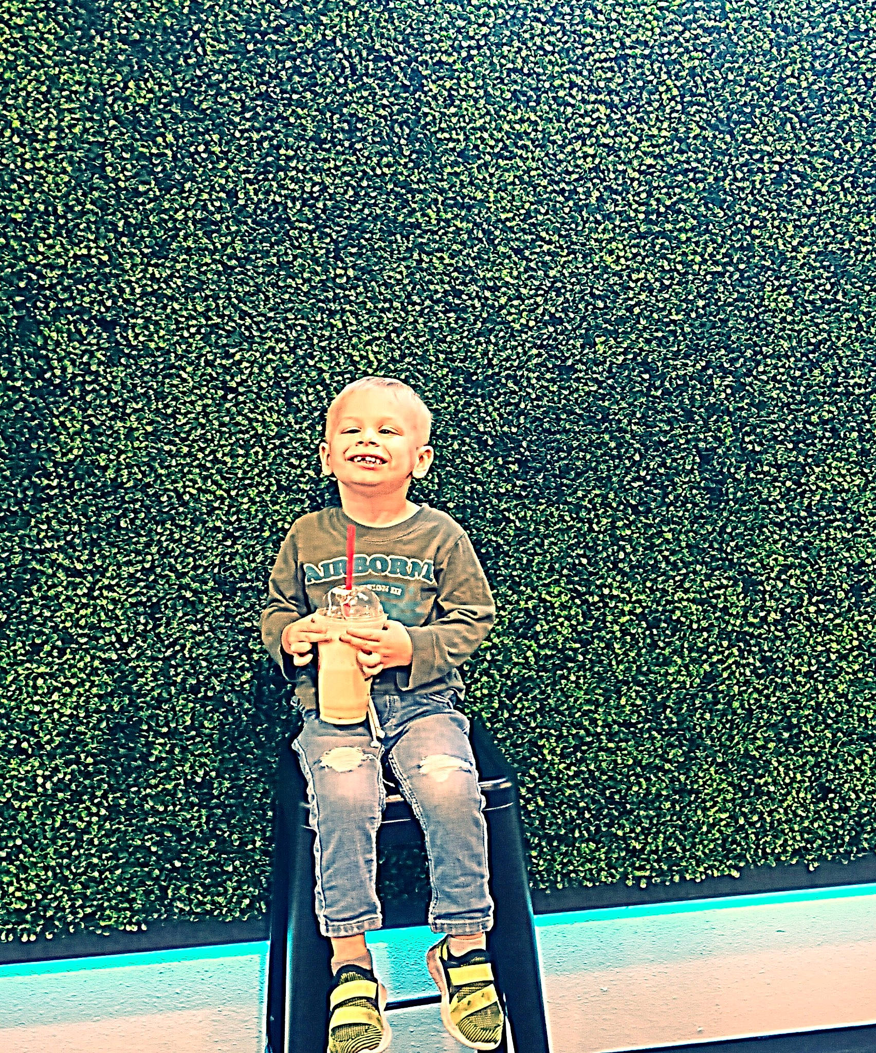 Rylyn is registered to the contest to win money with this photo: azure, boot, electric_blue, flooring, font, fun, grass, happy, illustration, joy, leisure, line, musical_instrument, pattern, people_in_nature, person, rectangle, shadow, sitting, smile