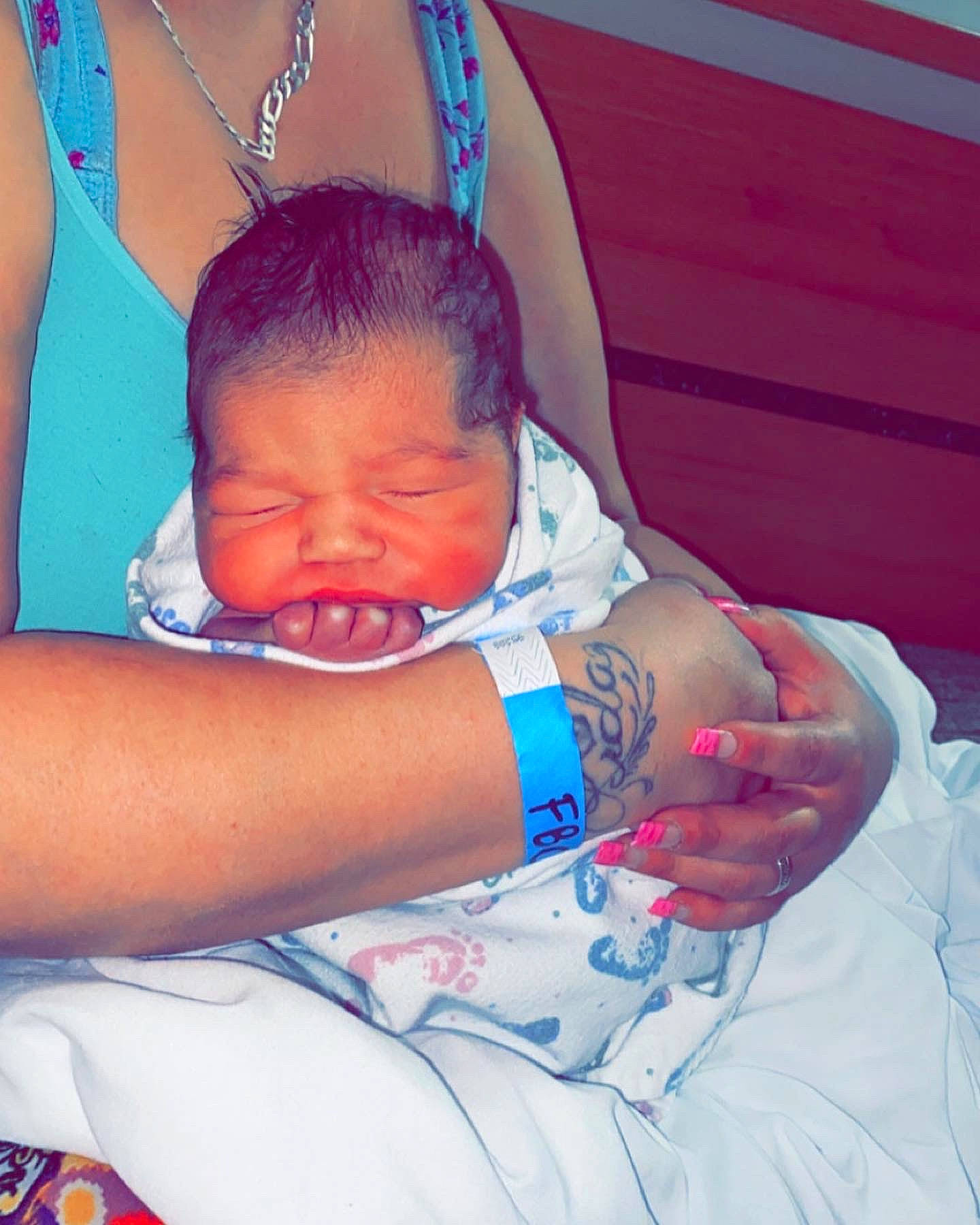 Wesley is registered to the contest to win money with this photo: azure, baby, blue, comfort, elbow, eye, finger, gesture, hand, happy, head, human_body, iris, joint, mouth, muscle, neck, organ, person, shoulder