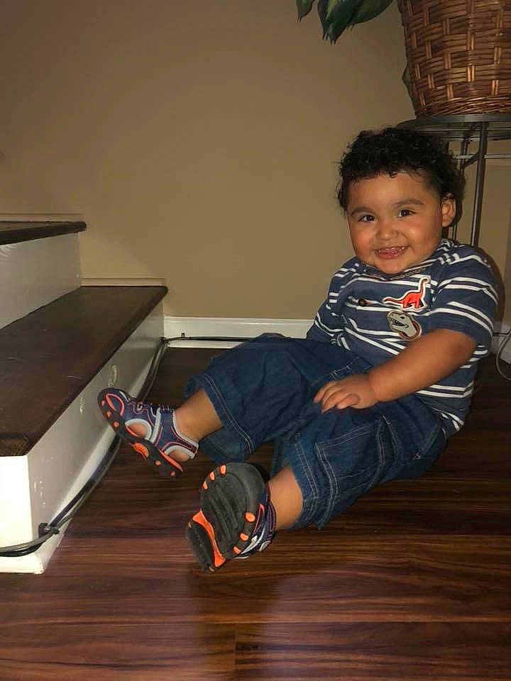 Lionel is registered to the contest to win money with this photo: baby, child, floor, flooring, footwear, fun, furniture, hardwood, joy, laminate_flooring, leg, person, play, shoe, sitting, smile, toddler, wood, wood_flooring