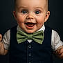 baby, child, smiling, bow_tie, vest, blue_eyes, portrait, happy, cute, formal_wear, infant, studio, fashion, person, face, clothing, buttoned_vest, hands, baby_boy, closeup