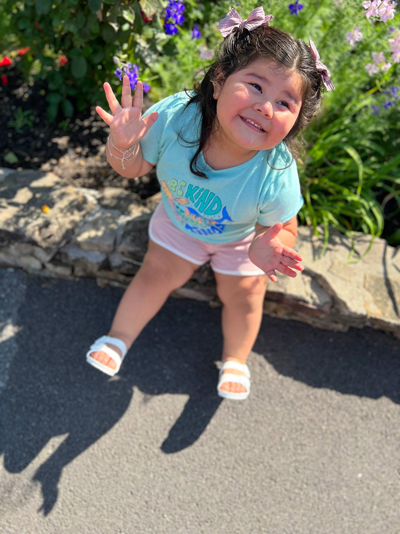 Arabella is registered to the contest to win money with this photo: child, electric_blue, face, facial_expression, flower, fun, grass, happy, headband, human_leg, joy, leisure, magenta, person, pink, plant, recreation, shorts, smile, summer