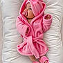 baby, infant, pink, robe, hood, bow, pacifier, slippers, soft, cushion, cute, child, indoor, sleepwear, comfort, lying, toddler, adorable, warm, person