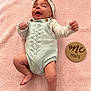 Addison is registered to the contest to win money with this photo: baby, blanket, bodypart, bonnet, cap, clothing, face, finger, glove, hand, hat, head, knitwear, newborn, person, photography, portrait, sitting, sweater, yawning