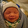 Christopher is registered to the contest to win money with this photo: baby, newborn, smiling, sleeping, blanket, hat, wrapped, cozy, infant, cute, face, headwear, soft, warm, comfort, child, portrait, peaceful, indoors, closeup