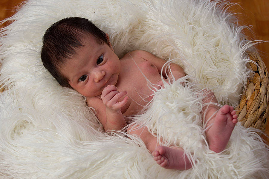 Carlos joined the competition — help win amazing prizes! baby, baby_toddler_clothing, child, comfort, couch, dress, event, fashion_accessory, fur, fur_clothing, grass, happy, hat, headband, iris, person, portrait_photography, sitting, skin, textile