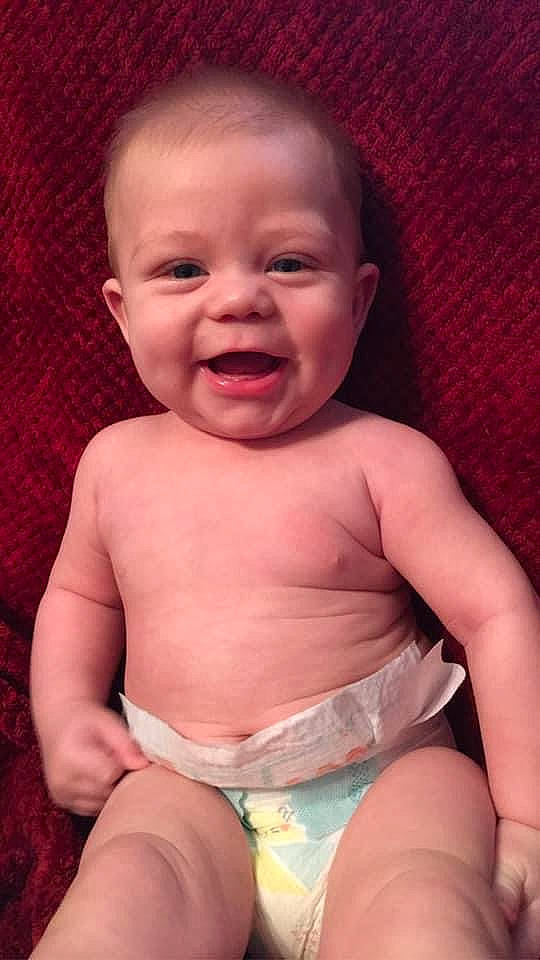 Colton is registered to the contest to win money with this photo: arm, cheek, chin, comfort, eye, eyebrow, facial_expression, hand, head, human_body, leg, lip, mouth, muscle, neck, nose, organ, person, skin, smile