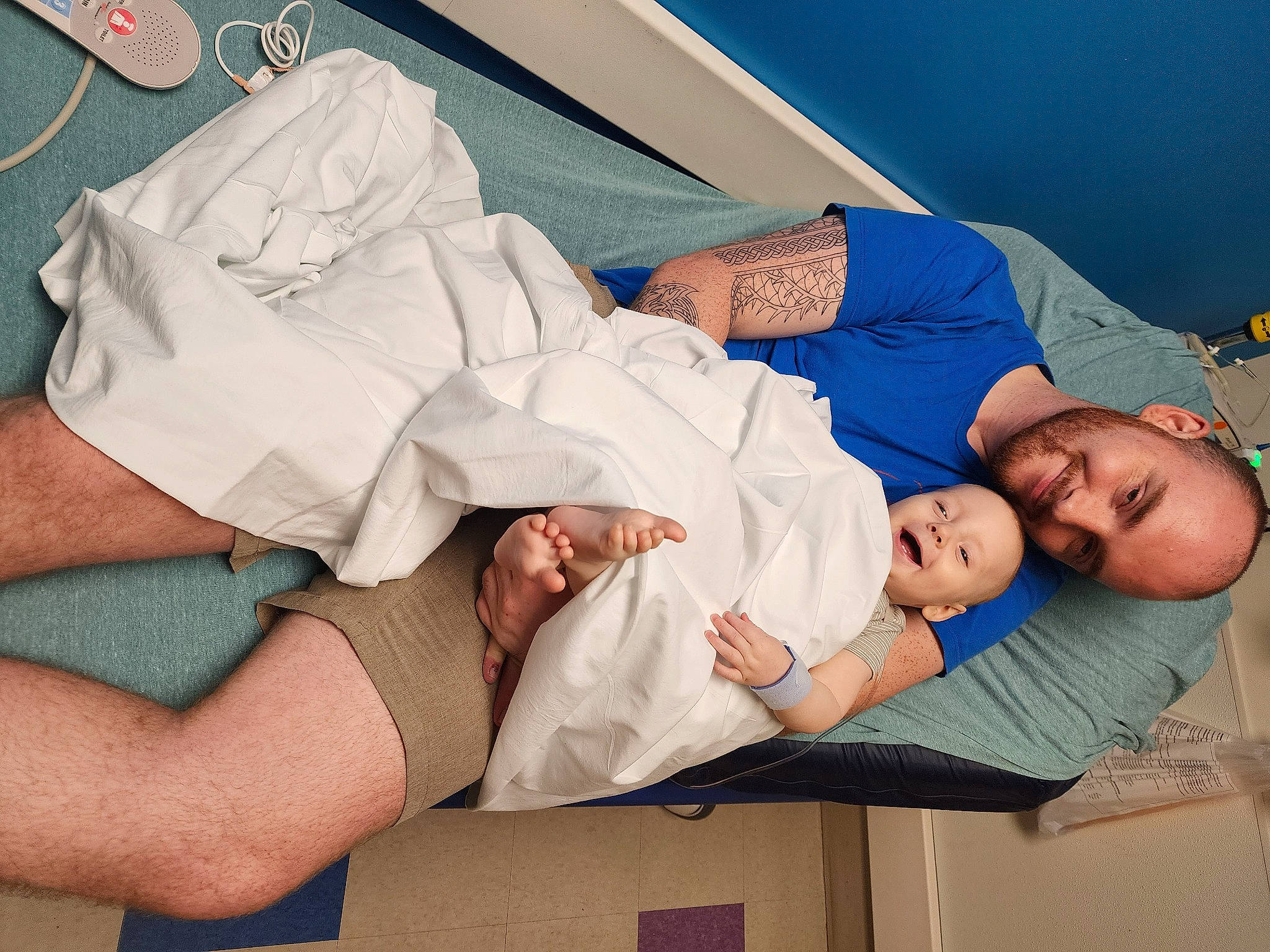 Finn is registered to the contest to win money with this photo: arm, child, comfort, elbow, event, finger, gesture, happy, health_care, hospital, hospital_bed, joint, joy, knee, leisure, linens, muscle, patient, person, service