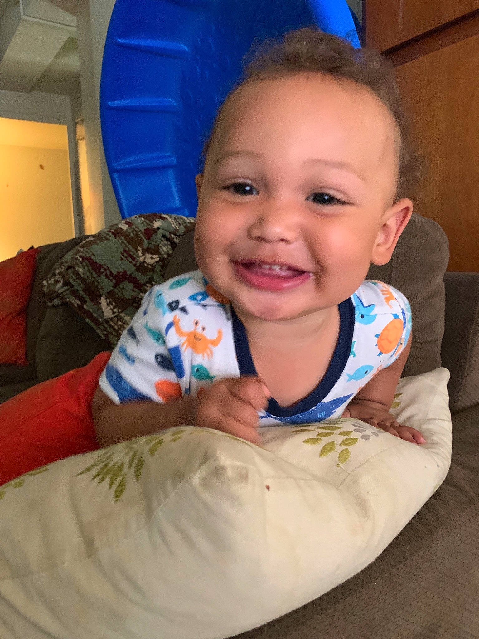 Izayah is registered to the contest to win money with this photo: baby, cheek, child, fun, head, joy, person, play, sitting, skin, smile, toddler, tummy_time