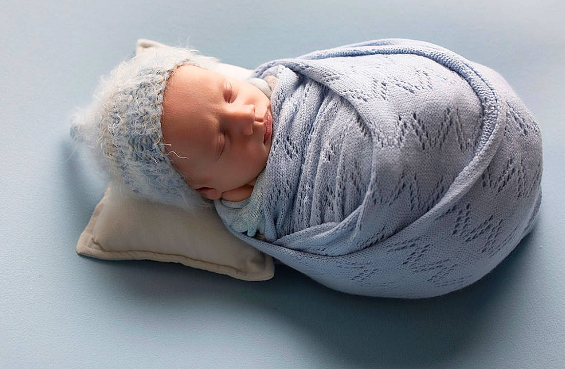 Callum joined the competition — help win amazing prizes! baby, baby_products, baby_sleeping, baby_toddler_clothing, beanie, bedding, bedtime, cap, child, comfort, eye, headgear, headwear, human_body, linens, nap, person, portrait_photography, room, sleep