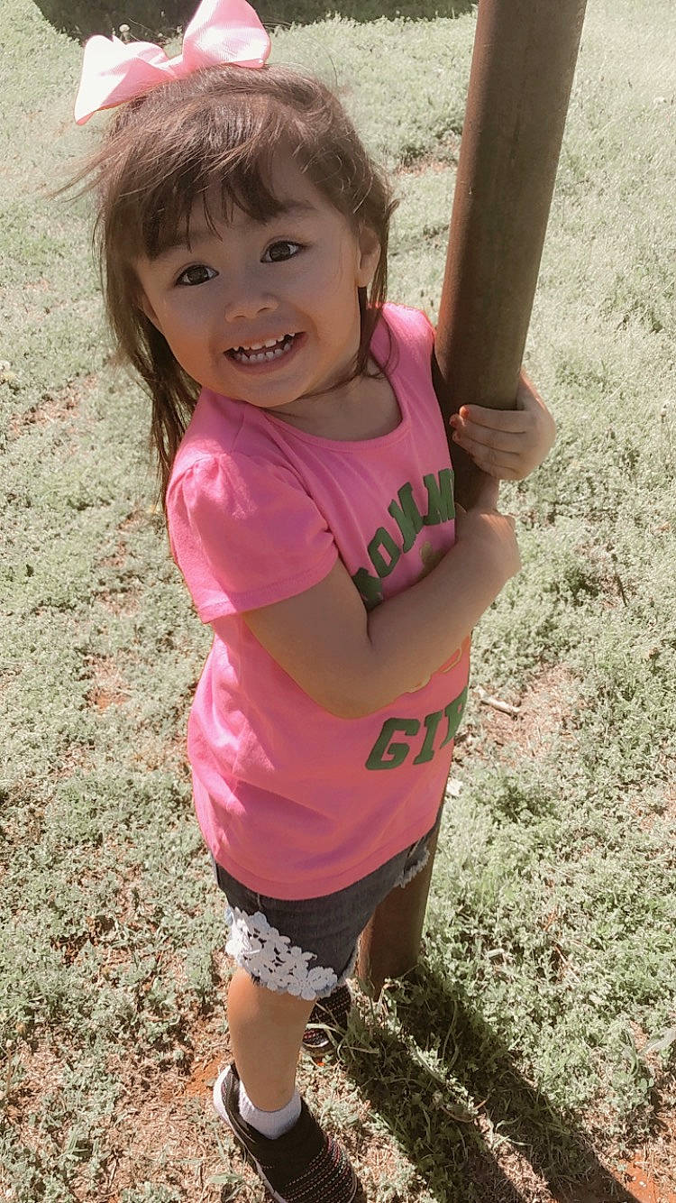 Rosaline is registered to the contest to win money with this photo: arm, child, fun, happy, joy, outdoor_play_equipment, person, pink, play, playground, skin, smile, t_shirt, toddler