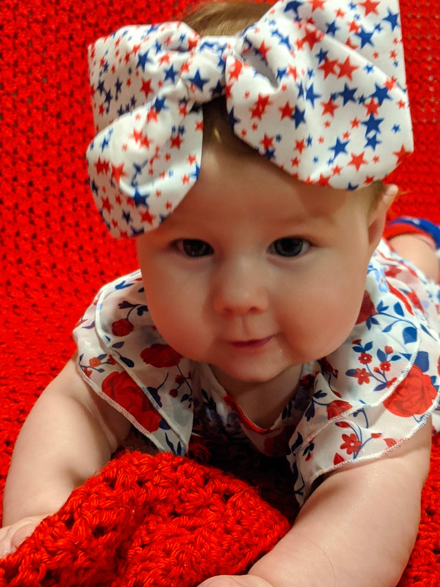 Cora joined the competition — help win amazing prizes! baby, baby_toddler_clothing, beauty, cap, child, close_up, face, facial_expression, happy, hat, headgear, headwear, knit_cap, lip, outerwear, pattern, person, photograph, red, sleeve