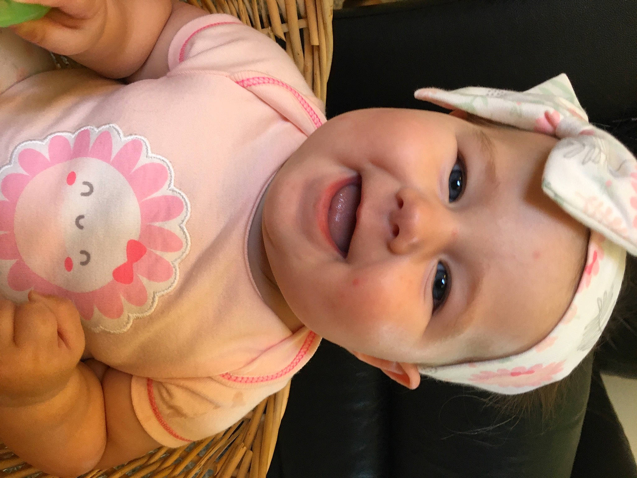 Cora is registered to the contest to win money with this photo: arm, baby_toddler_clothing, cheek, chin, ear, eye, eyebrow, eyelash, facial_expression, finger, happy, joy, lip, mammal, mouth, muscle, neck, nose, person, pink