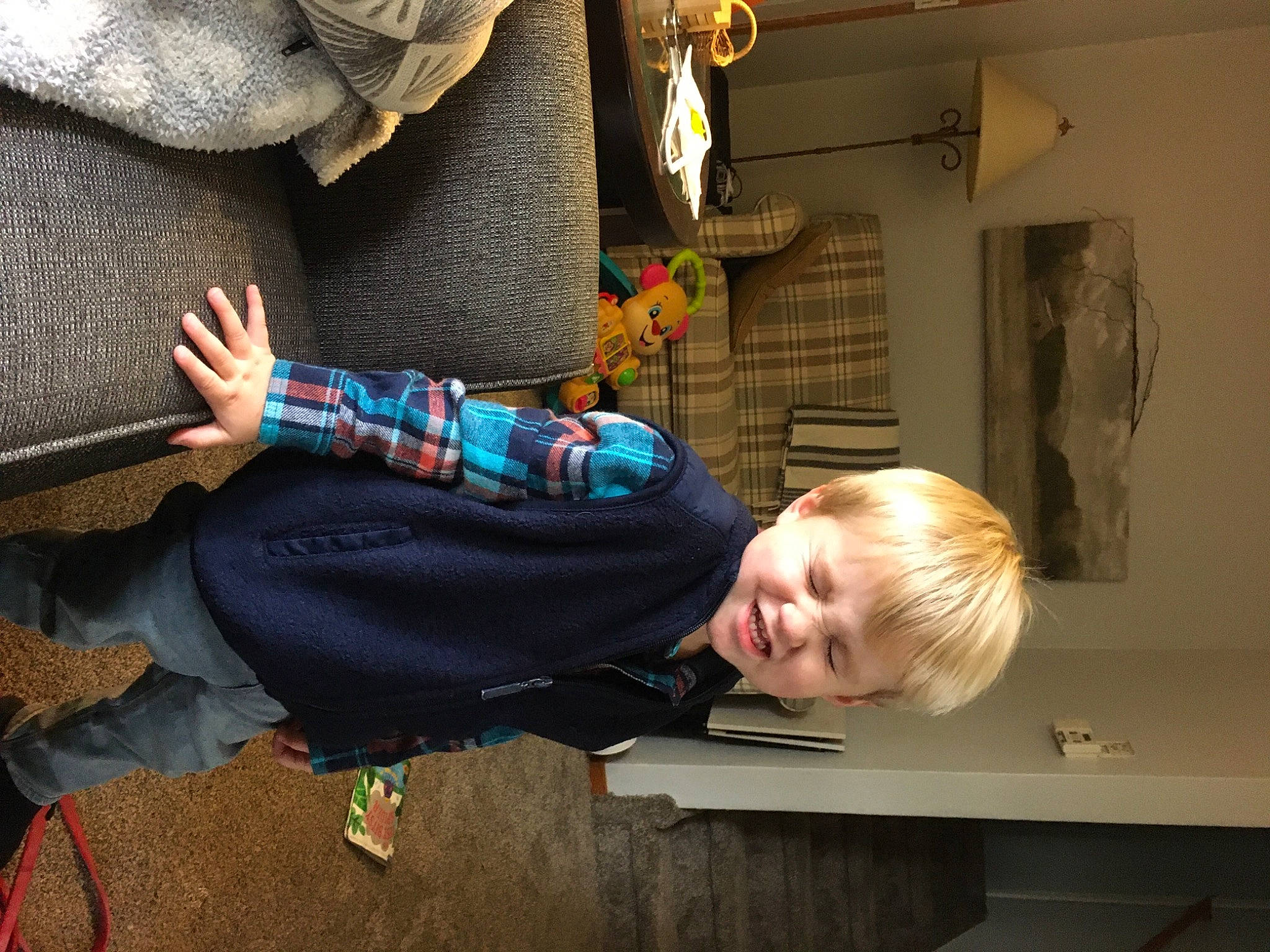 Samuel joined the competition — help win amazing prizes! child, comfort, electric_blue, flooring, fun, houseplant, person, picture_frame, room, sitting, smile, toddler, wood