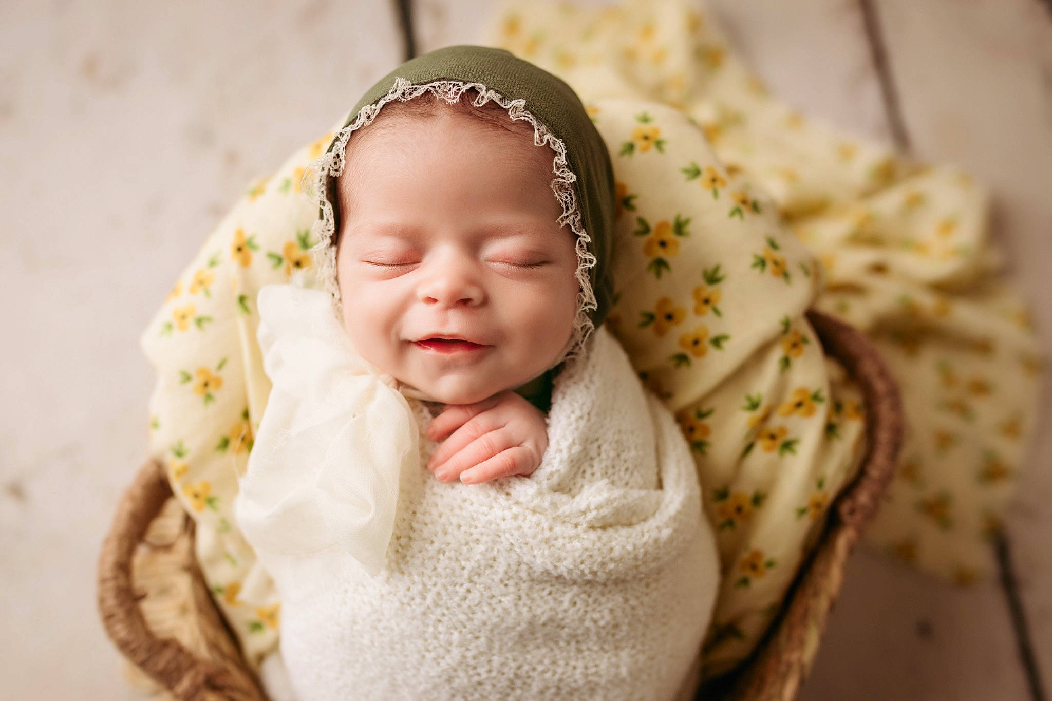 Ellie is registered to the contest to win money with this photo: baby, baby_toddler_clothing, child, close_up, clothing, comfort, fashion_accessory, grass, hair_accessory, happy, head, headgear, headpiece, headwear, jewellery, linens, pattern, peach, person, skin