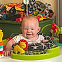 Teddy Keith joined the competition — help win amazing prizes! baby, child, walker, toys, smiling, indoor, playtime, colorful, activity_center, infant, happy, face, legs, clothing, furniture, background, plastic, red, yellow, green