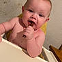 baby, child, high_chair, chewing, chocolate, food, indoor, person, furniture, table, skin, face, hand, head, cute, young, infant, smiling, seat, background
