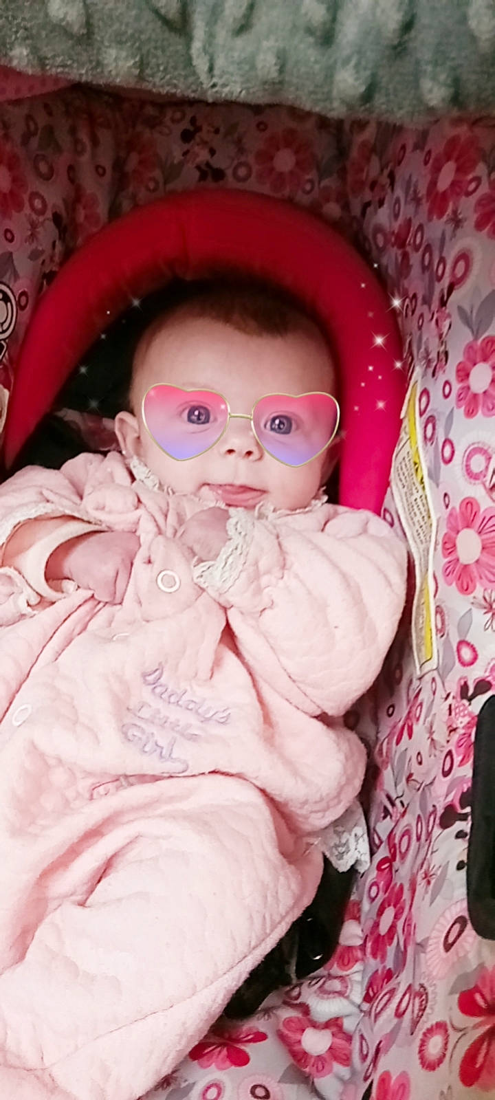 Alizabeth is registered to the contest to win money with this photo: baby_toddler_clothing, cheek, dress, eye, eyelash, eyewear, face, glasses, head, helmet, human_body, iris, lip, mouth, nose, person, pink, skin, sleeve, sunglasses