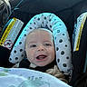 Weston joined the competition — help win amazing prizes! baby, car_seat, blanket, dinosaur_pattern, smiling, child, infant, seatbelt, happy, portrait, indoors, head_support, clothing, person, cute, young_child, car_interior, window, daylight, seat