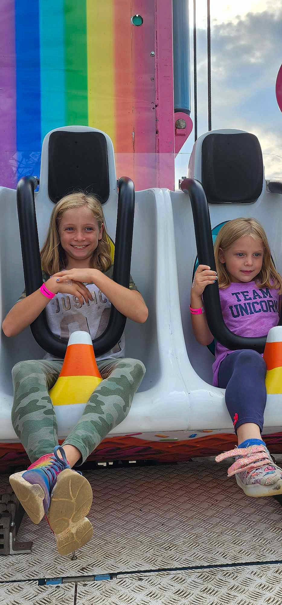 Miley joined the competition — help win amazing prizes! automotive_design, automotive_tire, child, fun, happy, joy, leisure, magenta, motor_vehicle, people, person, pink, recreation, shoe, shorts, sitting, smile, snapshot, sneakers, toddler