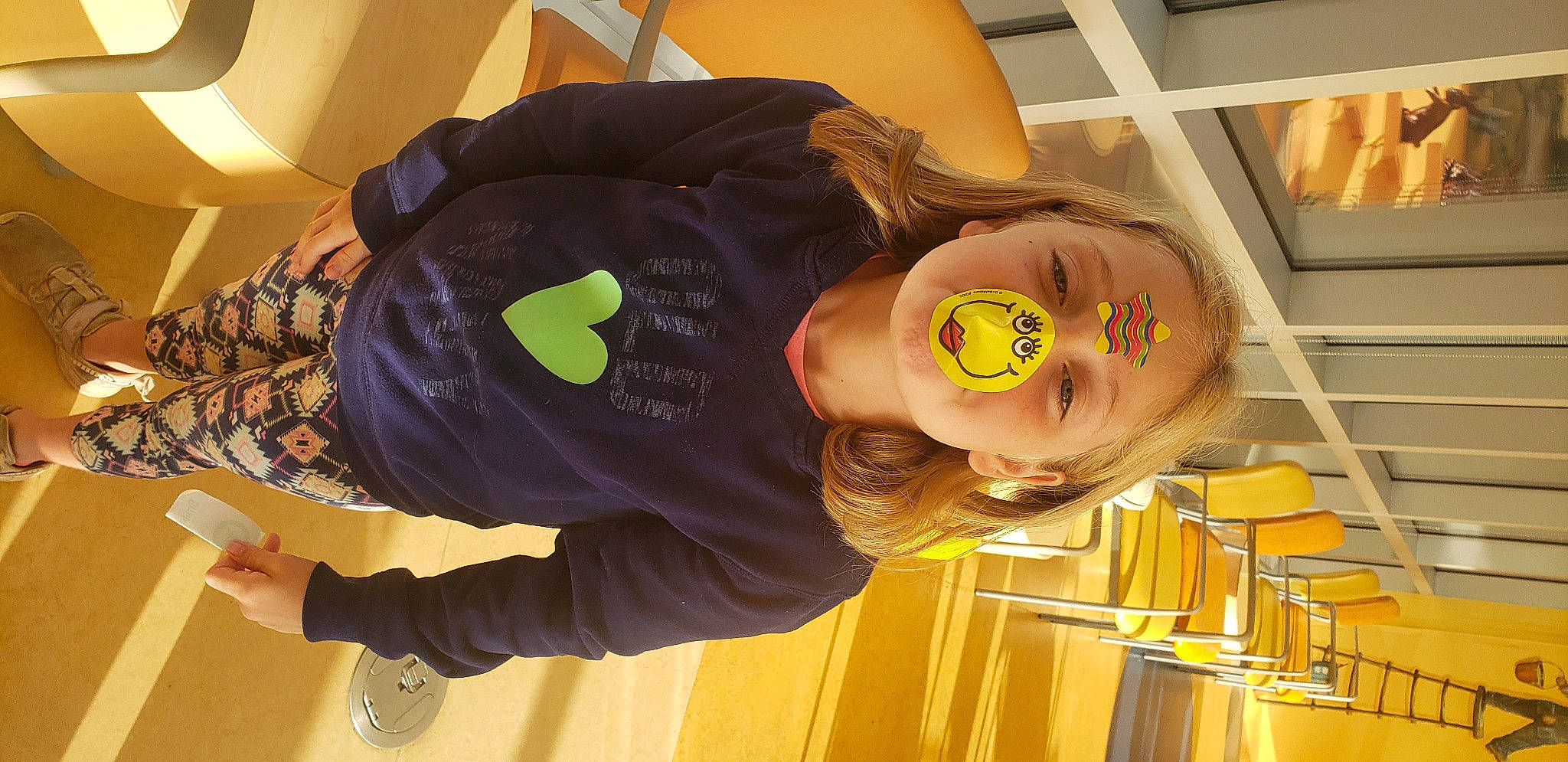 Miley is registered to the contest to win money with this photo: child, comfort, cool, eyewear, fun, hairstyle, happy, mouth, person, room, sleeve, smile, sunglasses, vision_care, wood