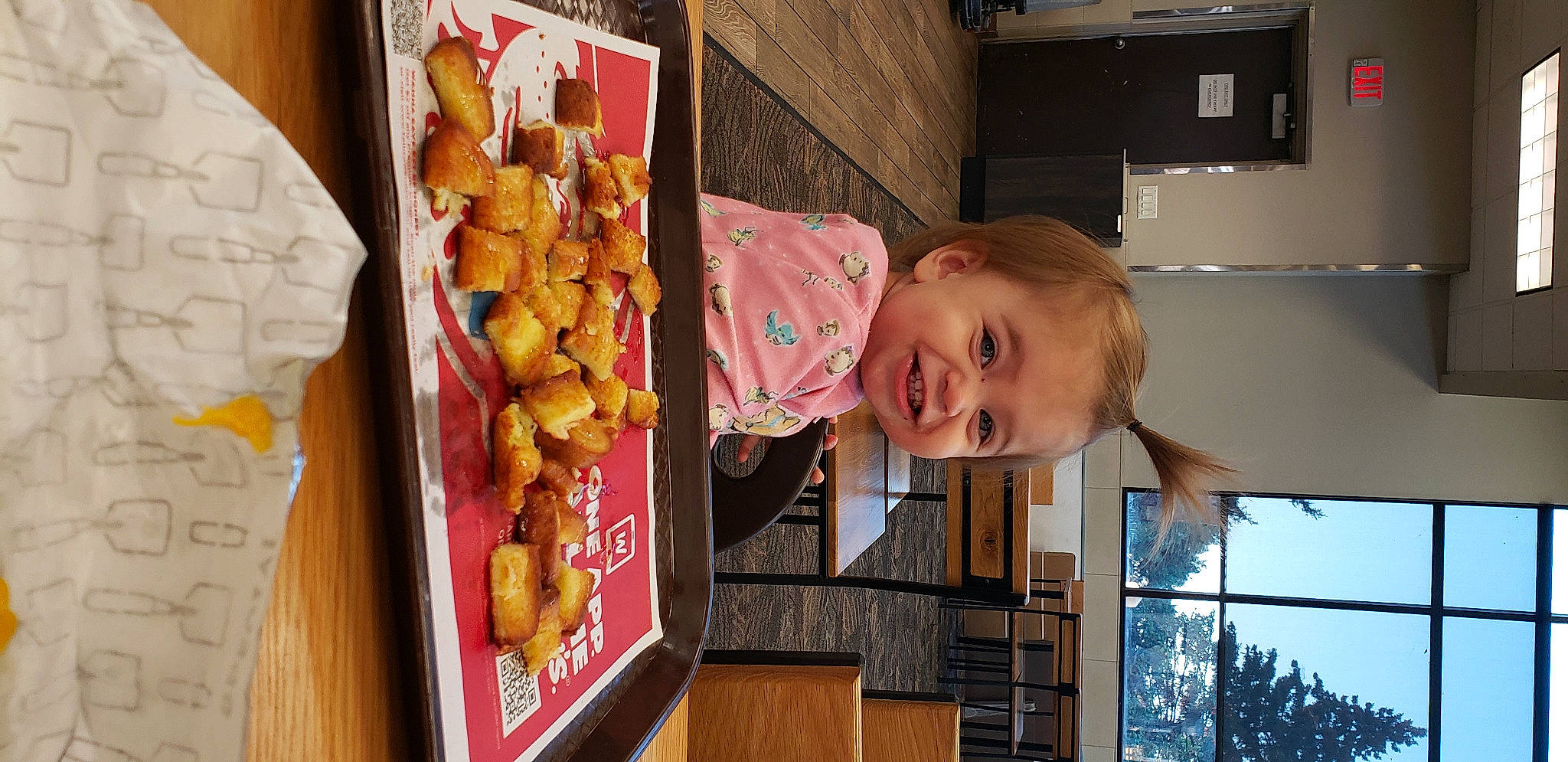 Paisley is registered to the contest to win money with this photo: baby, building, child, cuisine, food, fun, happy, joy, junk_food, leisure, person, play, room, smile, snack, sweetness, toddler, visual_arts, window, wood