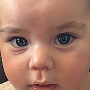 Mayron participe au concours pour gagner de l'argent avec cette photo : baby, child, face, blue_eyes, close_up, innocent, cute, soft_skin, expression, portrait, young, person, childhood, looking, eyelashes, hair, clothing, curious, mouth, skin