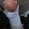 baby, child, infant, kneeling, blue_shirt, gray_pants, carpet, couch, toy, indoor, curiosity, exploration, back_view, clothing, floor, person, young_child, head, hair, home
