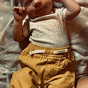 Lachlan joined the competition — help win amazing prizes! baby, infant, blanket, clothing, pants, shirt, face, hand, skin, lying_down, comfort, soft_texture, cute, peaceful, indoors, child, young, portrait, relaxed, smiling