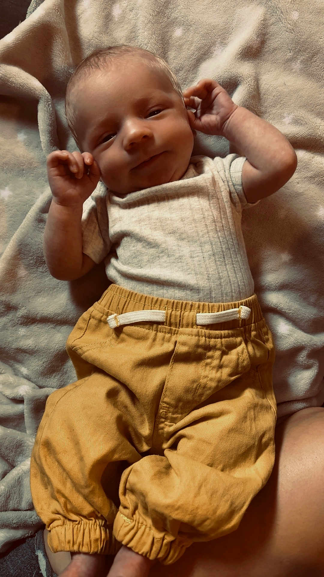 Lachlan joined the competition — help win amazing prizes! baby, infant, blanket, clothing, pants, shirt, face, hand, skin, lying_down, comfort, soft_texture, cute, peaceful, indoors, child, young, portrait, relaxed, smiling
