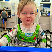 Austin joined the competition — help win amazing prizes! toddler, child, shopping_cart, walmart, buzz_lightyear, green_clothing, pharmacy, store, shopping, smile, blue_eyes, indoor, person, seat_belt, casual_clothing, retail, young_child, cute, happy, portrait