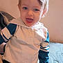 Austin is registered to the contest to win money with this photo: toddler, child, smiling, blue_eyes, hoodie, sitting, indoor, couch, happy, cute, hair, face, person, young_child, casual_clothing, portrait, light, expression, playful, comfortable