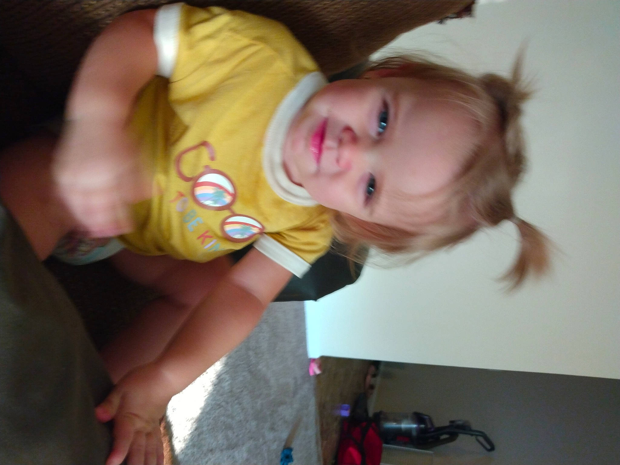 Grace is registered to the contest to win money with this photo: baby, baby_products, baby_toddler_clothing, cheek, child, ear, elbow, eye, fun, happy, head, iris, mouth, nose, person, sitting, skin, smile, t_shirt, thumb