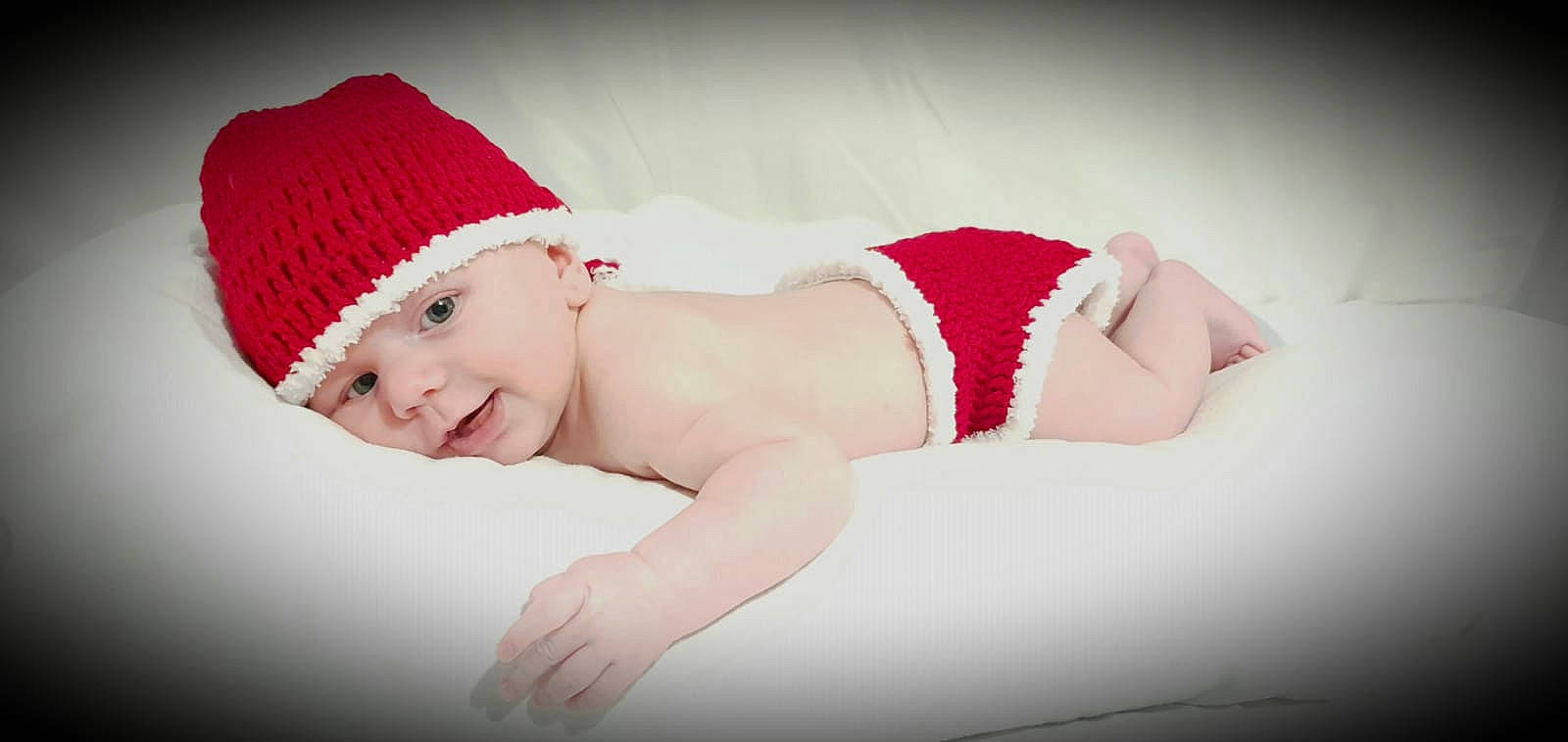 Henry joined the competition — help win amazing prizes! baby, beanie, bonnet, cap, child, costume_accessory, fashion_accessory, fictional_character, hat, headgear, headwear, knit_cap, person, photo_shoot, photograph, photography, pink, red, skin, toddler