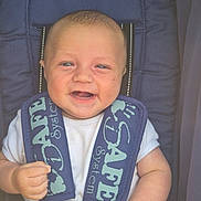 Waylan is registered to the contest to win money with this photo: baby, child, smiling, car_seat, safety_straps, white_shirt, infant, happy, closeup, blue, seat, hands, cute, portrait, person, baby_face, infant_clothing, safety, child_seat, baby_hands