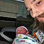 Ronin joined the competition — help win amazing prizes! adult, baby, beard, blanket, caring, closeup, colorful, duck_pattern, face, family, hospital, indoor, newborn, nose_piercing, person, portrait, swaddled, together, warmth, young