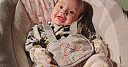 Oakley joined the competition — help win amazing prizes! adorable, baby, baby_clothes, baby_rocker, child, comfort, cozy, cute_outfit, face, floral_pattern, happy, home, indoors, infant, person, pink_socks, seated, small_child, smiling, soft_lighting