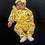 Gitzel joined the competition — help win amazing prizes! baby, bear_pattern, black_couch, child, clothing, comfortable, couch, cute, expression, face, footwear, headband, indoors, infant, person, portrait, relaxed, sitting, socks, yellow_outfit