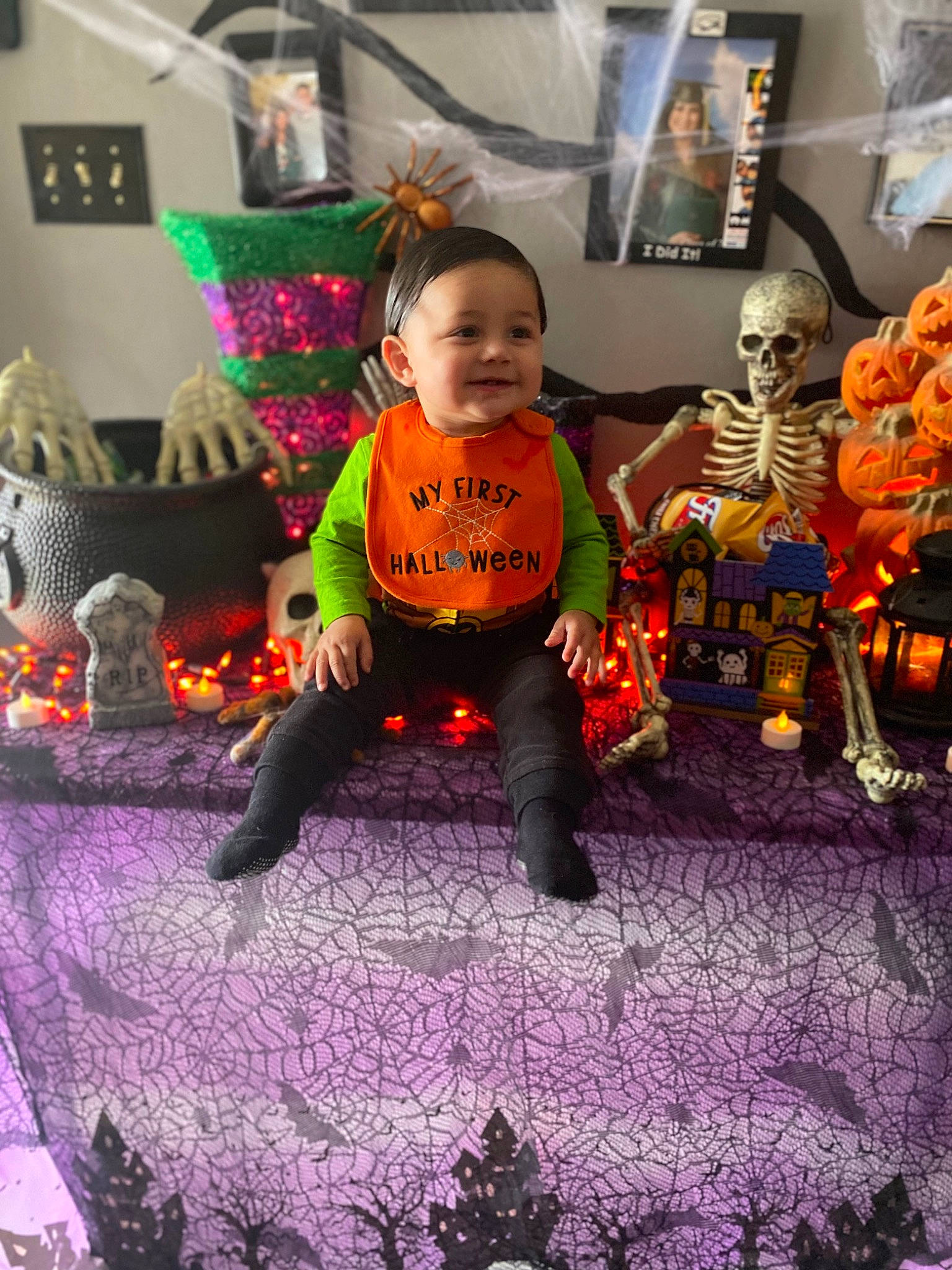 Kalvin is registered to the contest to win money with this photo: animation, baby, blurred, child, event, fictional_character, flooring, fun, happy, joy, leisure, orange, party, party_supply, person, pumpkin, purple, room, stuffed_toy, t_shirt