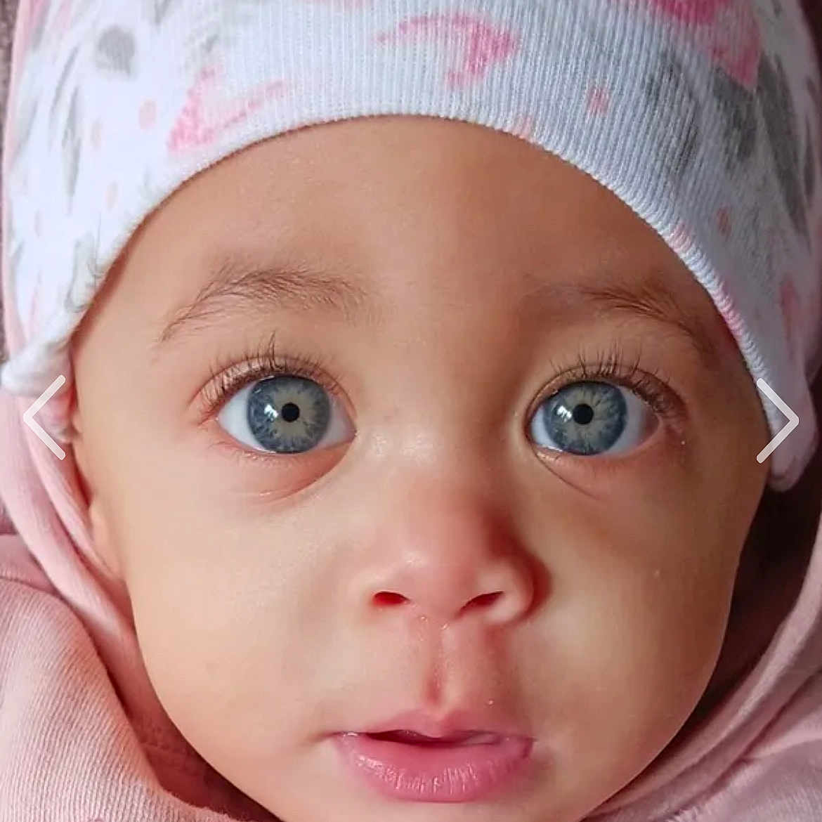 Kalinah is registered to the contest to win money with this photo: baby, bonnet, cap, clothing, cosmetics, crying, earbuds, electronics, face, happy, hat, head, lipstick, person, photography, portrait, sad, skin, smile, sweating