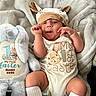 Rome joined the competition — help win amazing prizes! baby, infant, onesie, hat, plush_toy, blanket, cute, easter, soft_texture, smiling, child, socks, indoors, resting, cuddly, adorable, young_child, celebration, holiday, comfort