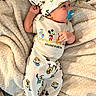 baby, infant, pacifier, hat, mouse_ears, disney, disney_characters, blanket, soft_texture, cute, clothing, sleepwear, lying_down, baby_girl, baby_boy, indoors, child, portrait, comfort, relaxation