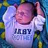 Rome joined the competition — help win amazing prizes! baby, newborn, sleeping, onesie, text, blanket, blue, yellow, cozy, infant, face, peaceful, soft, child, portrait, clothing, resting, cute, person, indoors