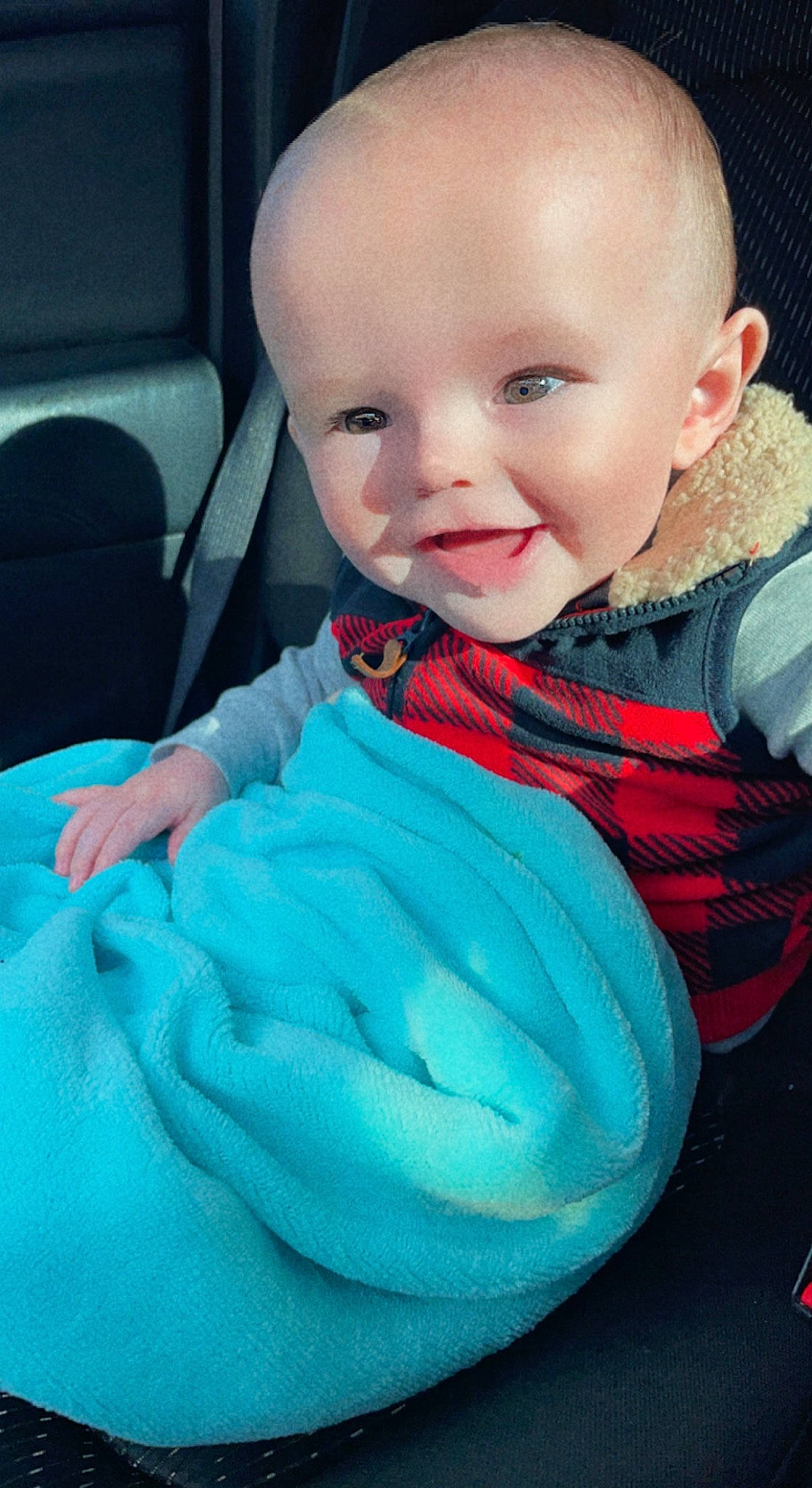 Deacon is registered to the contest to win money with this photo: aqua, baby, baby_toddler_clothing, cheek, comfort, cool, electric_blue, eyebrow, finger, happy, head, iris, mouth, neck, nose, outerwear, person, skin, sleeve, smile