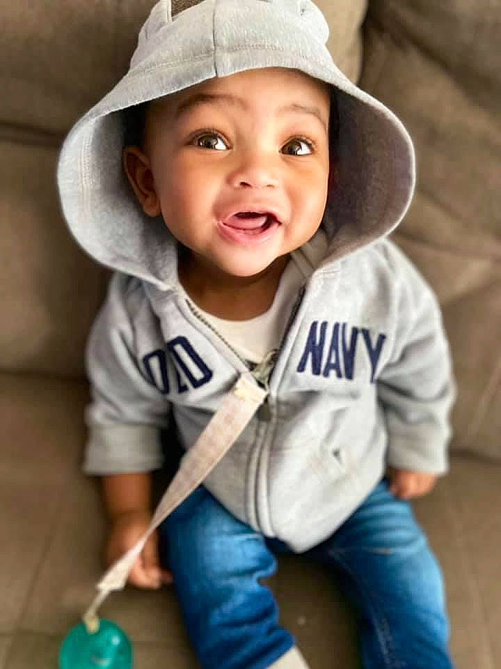 Dakari joined the competition — help win amazing prizes! baby, baby_toddler_clothing, bonnet, cheek, child, child_model, cool, denim, headwear, jeans, mouth, organ, person, portrait_photography, skin, sun_hat, surprise, toddler