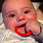 Carter is registered to the contest to win money with this photo: baby, biting, bodypart, couch, cutlery, face, finger, furniture, hand, happy, head, mouth, newborn, person, photography, portrait, smile, spoon, teeth, toy