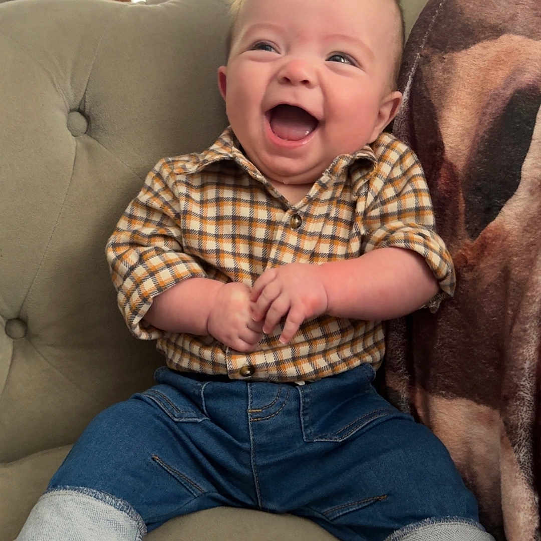 Colson joined the competition — help win amazing prizes! architecture, baby, babylaughing, building, clothing, couch, face, furniture, happy, head, indoors, jeans, laughing, livingroom, pants, person, photography, portrait, room, sitting