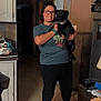 Ruger is registered to the contest to win money with this photo: audio_equipment, carnivore, costume, dog_breed, event, eyewear, fawn, flooring, fun, hardwood, joint, kitchen_appliance, knee, personal_protective_equipment, room, shoulder, standing, t_shirt, thigh, toy