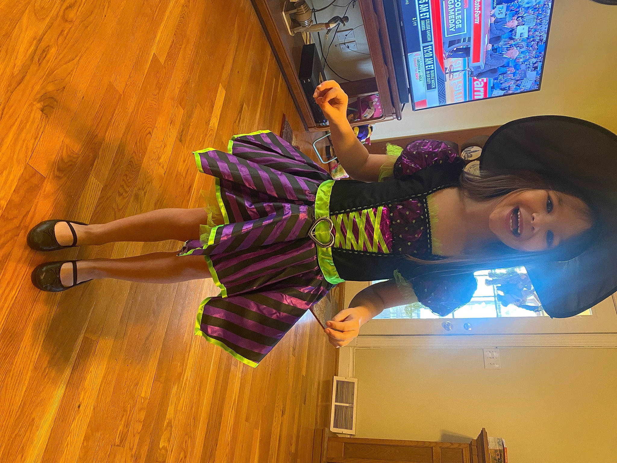 Brynlee is registered to the contest to win money with this photo: event, flooring, foot, fun, happy, hardwood, hat, human_leg, joy, knee, laminate_flooring, leisure, magenta, person, purple, room, sandal, sock, thigh, varnish