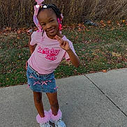 Tommie Jones is registered to the contest to win money with this photo: accessories, autumn, birthday_shirt, bows, braids, child, concrete, denim_skirt, fallen_leaves, girl, grass, headband, outdoors, pink, playful, portrait, pose, sidewalk, smiling, sneakers