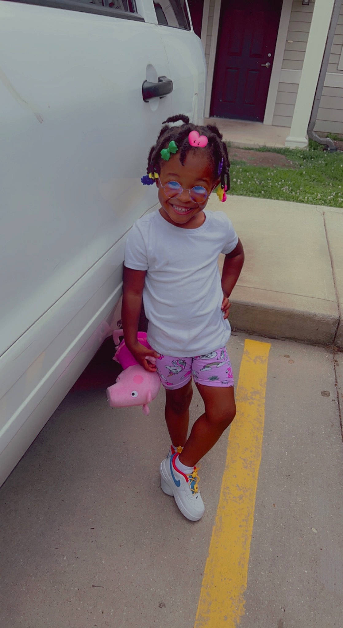 Tommie Jones is registered to the contest to win money with this photo: baby_toddler_clothing, child, cool, door, eyewear, footwear, fun, happy, human_leg, joy, knee, magenta, person, pink, purple, shorts, sleeve, sneakers, sock, t_shirt